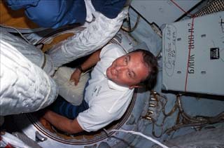 Mission specialist Vladimir Titov floats into the Kristall module. 